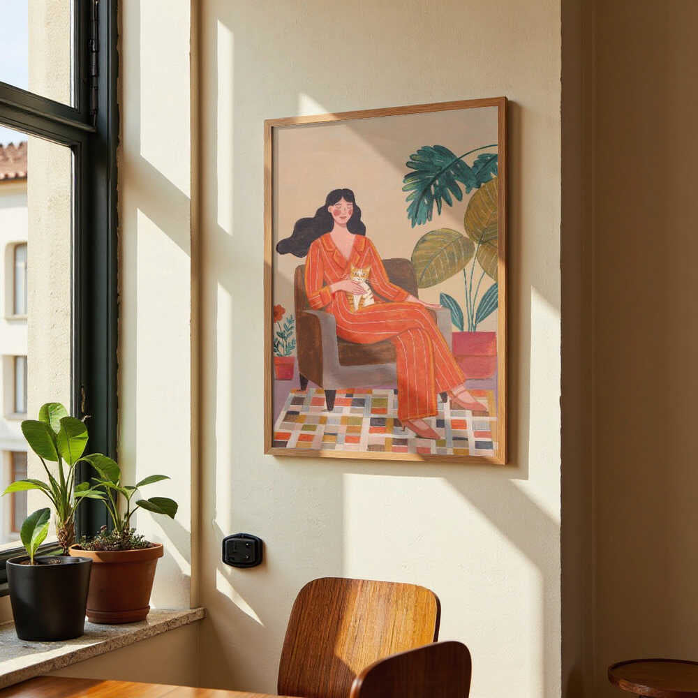 Woman with cat in living room with warm earth tones by Caroline Bonne Müller