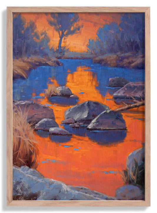 Sonnenuntergang über einem ruhigen Fluss von Cody DeLong