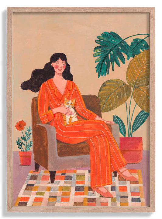 Woman with cat in living room with warm earth tones by Caroline Bonne Müller